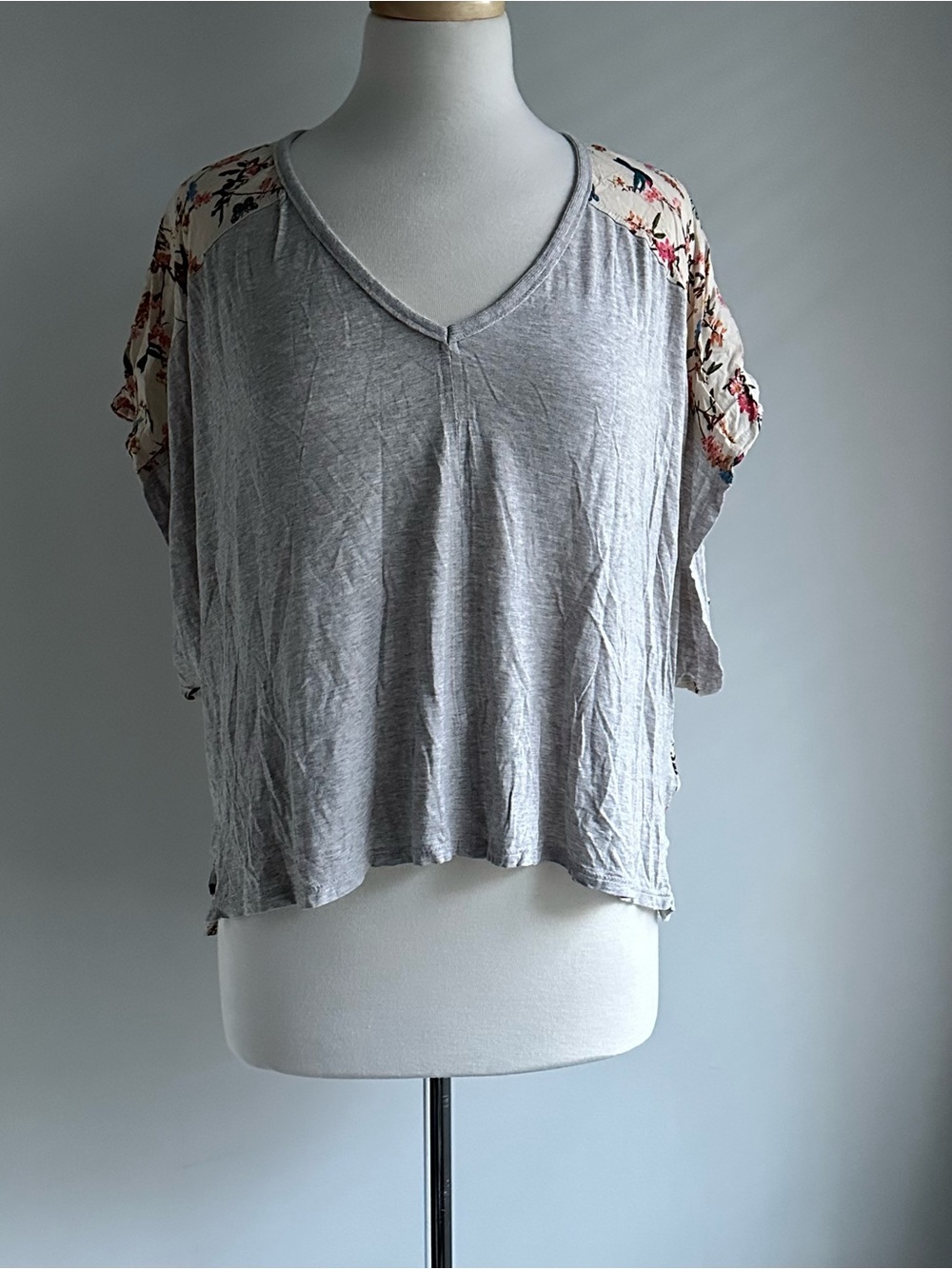 Light Gray V-Neck Women’s Top with Floral Sleeve Accents